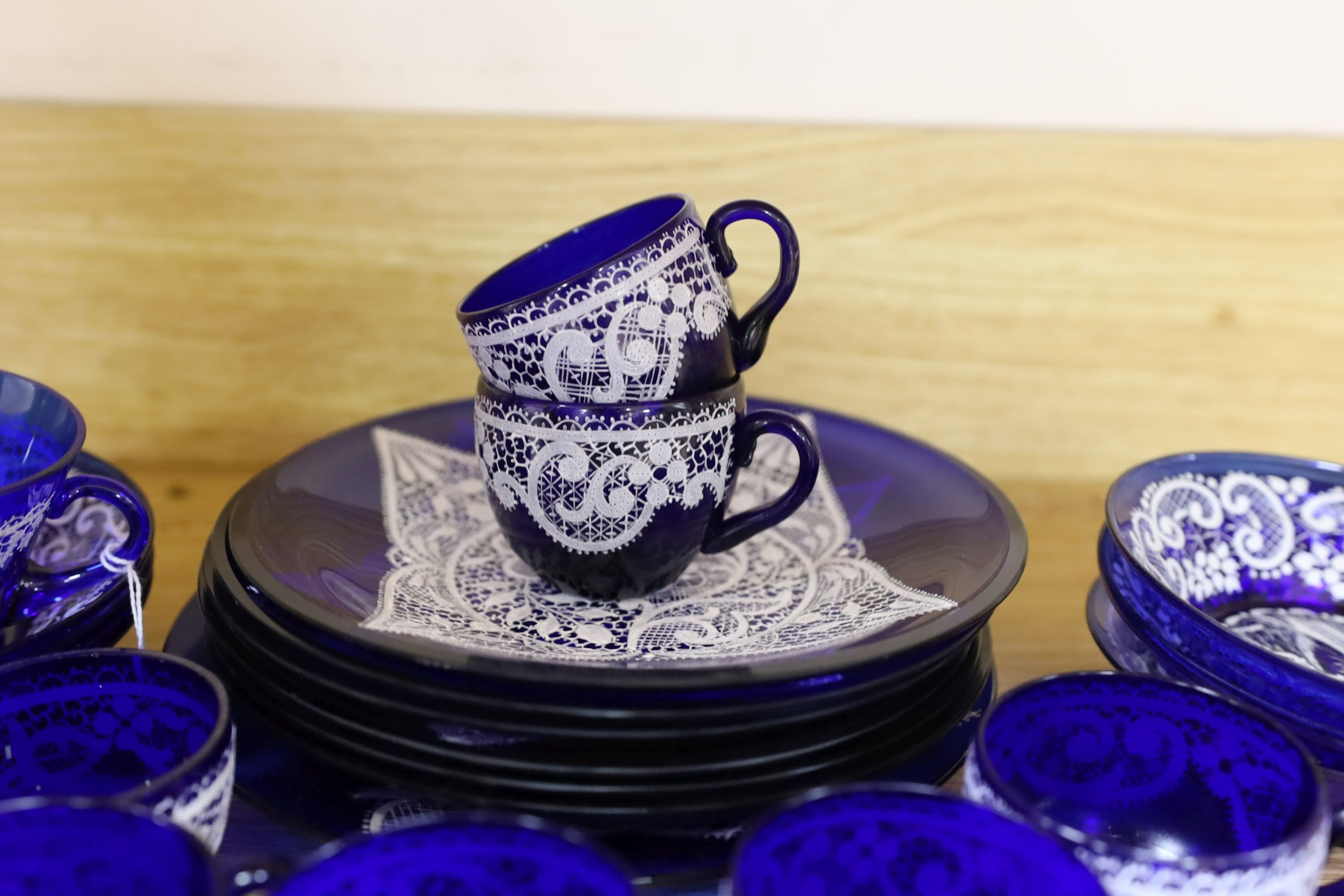 A quantity of Venetian lace pattern enamelled glass teaware